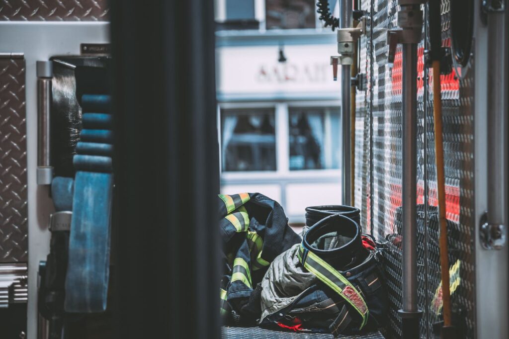 A detailed shot of firefighter gear inside a fire truck, emphasizing emergency readiness.